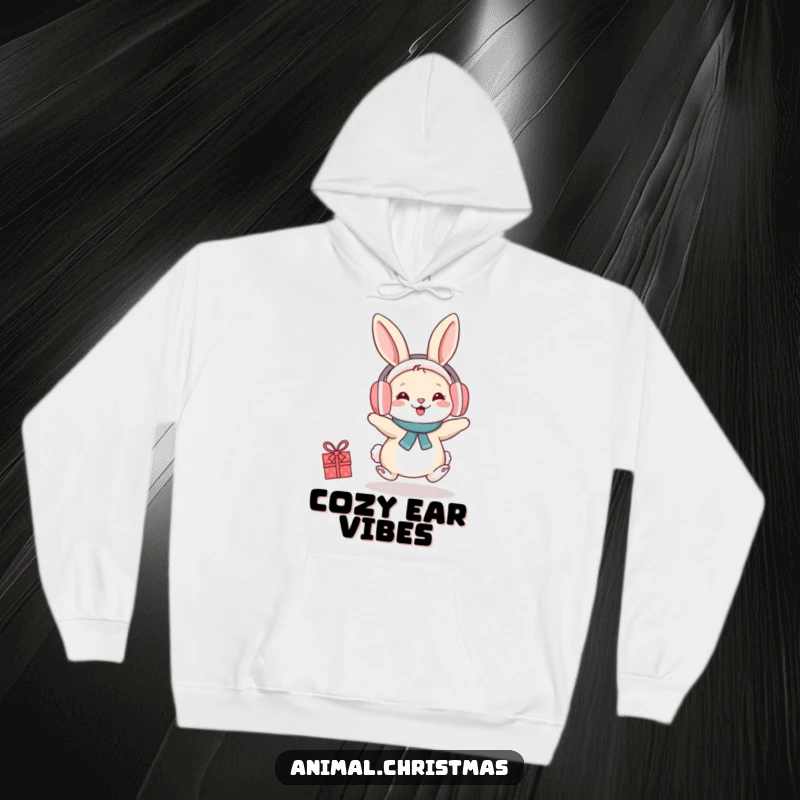 Funny hoodie with a happy rabbit wearing earmuffs, hopping with delightful festive cheer and cozy warmth.