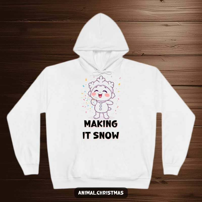 Funny hoodie with a snowflake character gleefully blowing colorful confetti, offering cozy and festive winter wear.