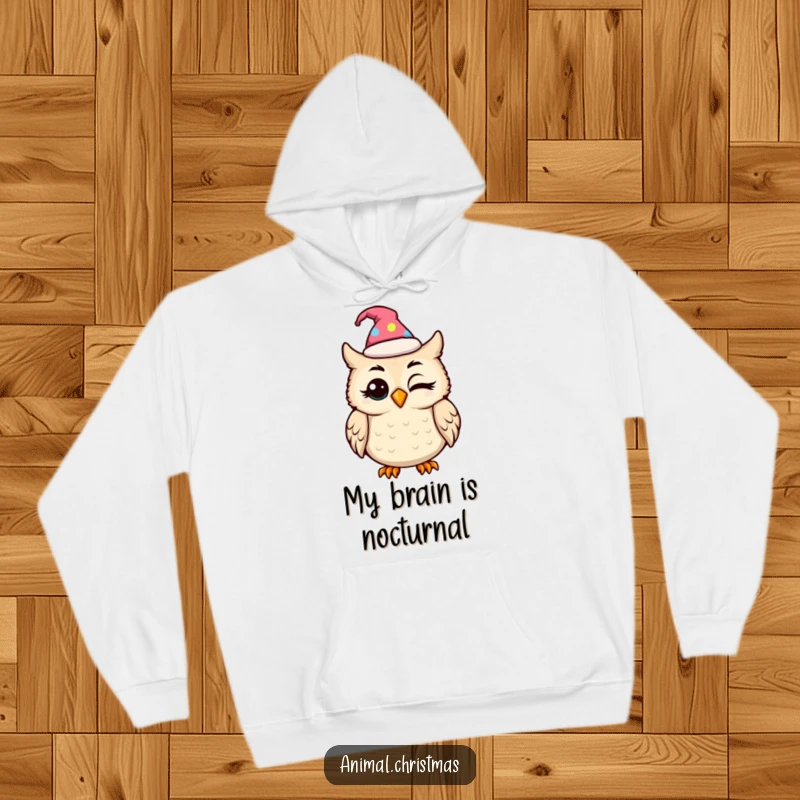 Funny kawaii owl in a festive hat blinking with amusement, featured on a soft and warm hoodie.