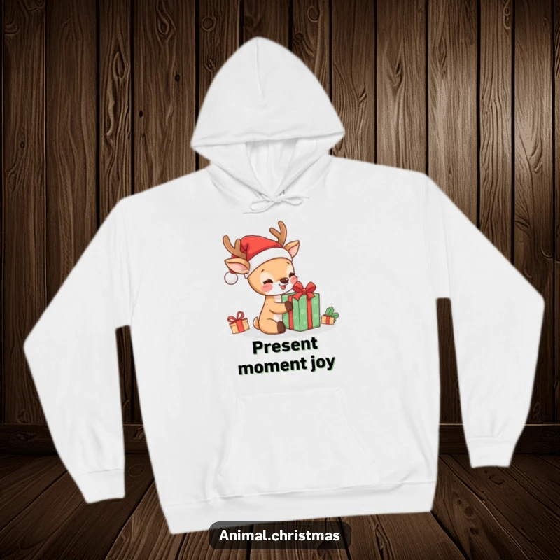 Funny kawaii deer in Santa hat, excitedly opening a present, cozy on a hoodie, embodying Christmas joy and humor.