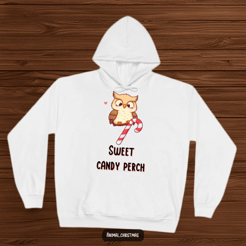 Funny hoodie with a wise owl perched on a candy cane, hooting merrily, offering cozy festive vibes.