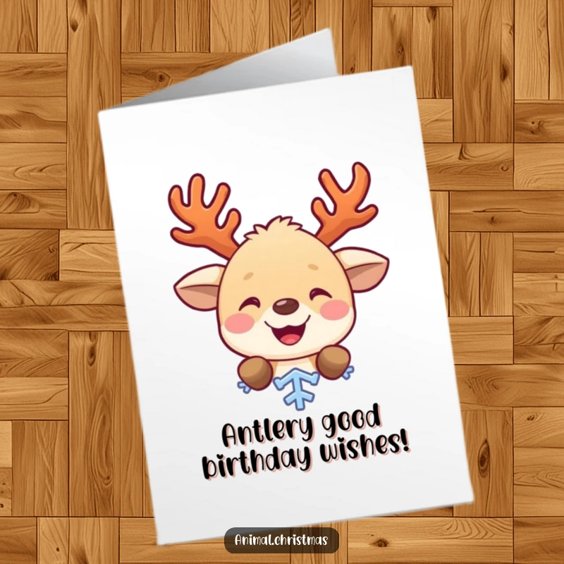 Funny Free Printable Birthday Card featuring a cute animal with antlers peeking from behind a snowflake, wishing a Happy Birthday.