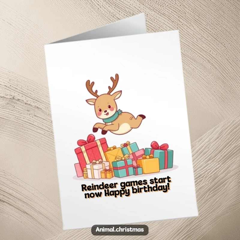 Funny Free Printable Birthday Card: A cute reindeer leaping joyfully over a pile of presents, conveying pure birthday excitement.