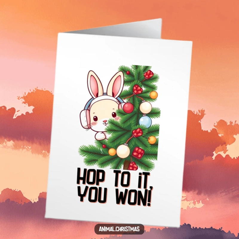 Free Printable Congratulations Card: A rabbit sporting earmuffs peeks from a decorated pine, sharing warm wishes for success.