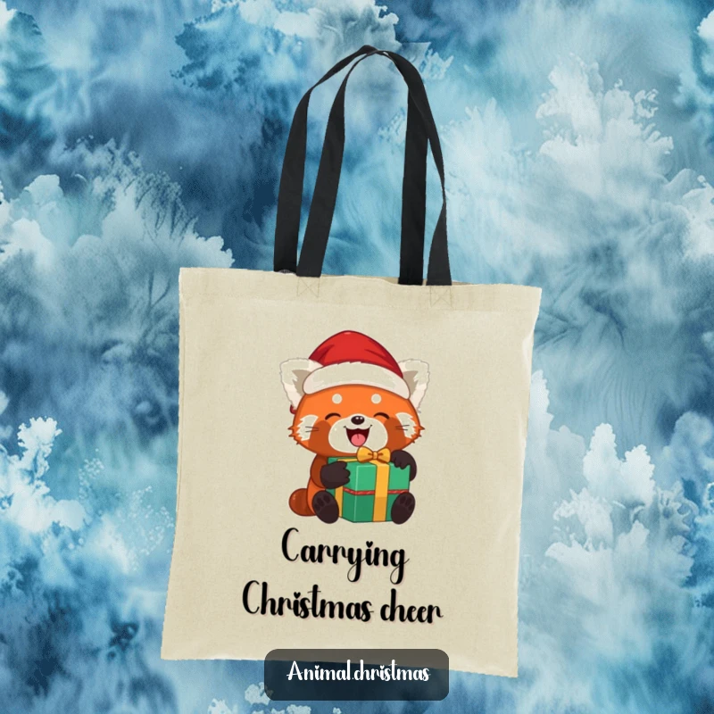 Funny red panda Santa tote bag with a red panda joyfully unwrapping a gift while wearing a Santa hat, ideal for holiday shopping.