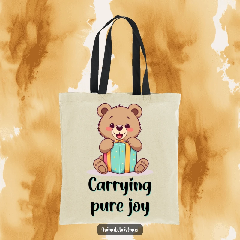 Funny tote bag featuring an ecstatic bear cub unwrapping a beautifully colored gift, ideal for carrying daily essentials.