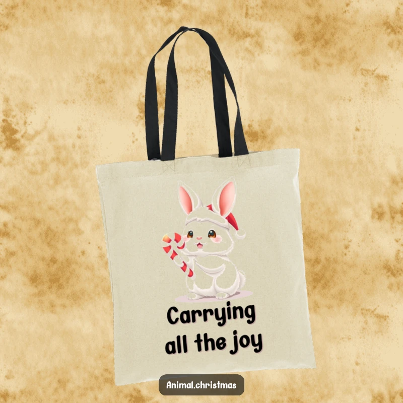 Funny Christmas tote bag with a fluffy white bunny wearing a Santa hat and holding a glowing candy cane, perfect for carrying holiday items.