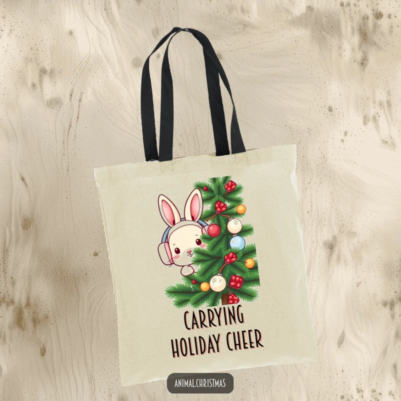 Funny rabbit tote bag designed with a cute rabbit in earmuffs peeking from behind a festive pine tree for a winter look.